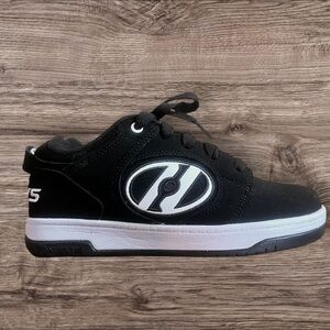 Heelys Black and White Roller Shoes.
